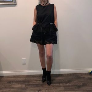 Black top and shorts with faux pearls and lace.